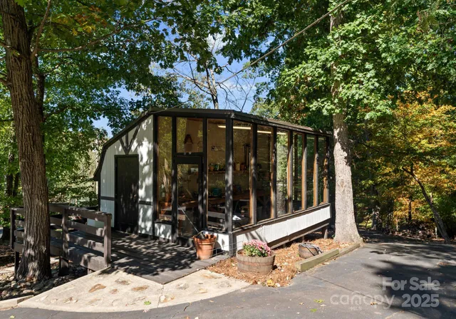 a view of a wooden bench under an umbrella