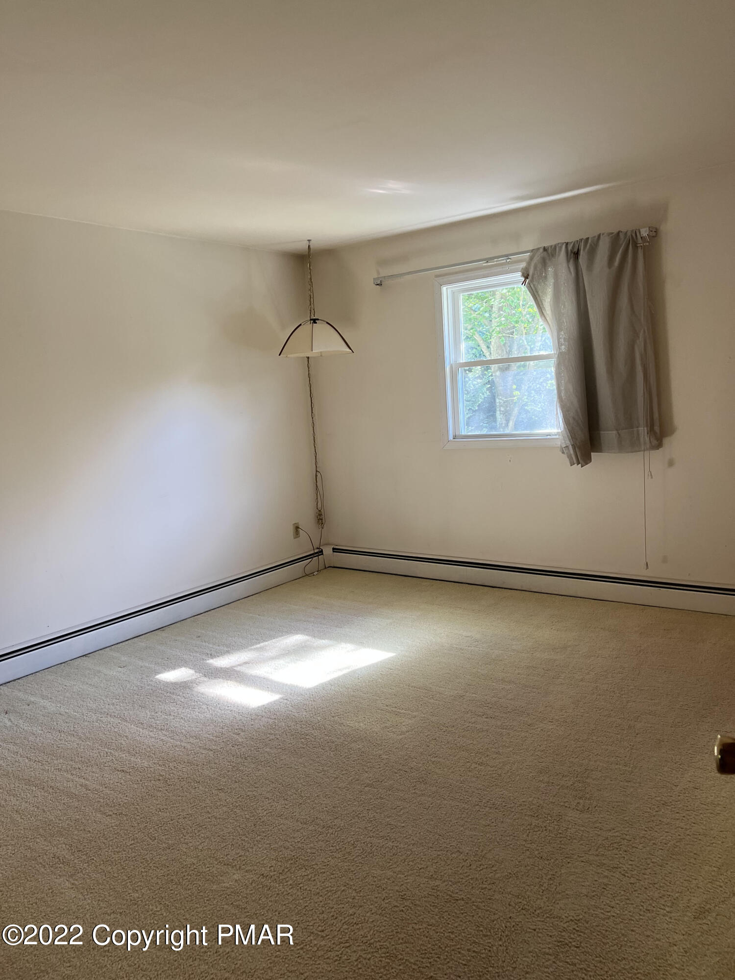 240 Winona Road Mount Pocono, PA 18344 - Photo 7 of 9 an empty room with a window