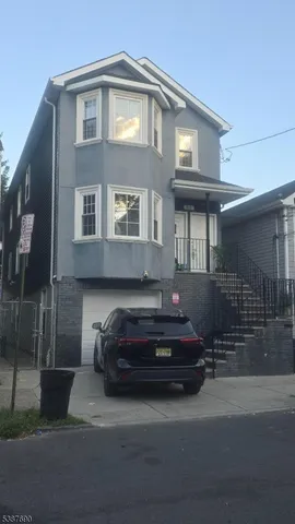 a car parked in front of a house