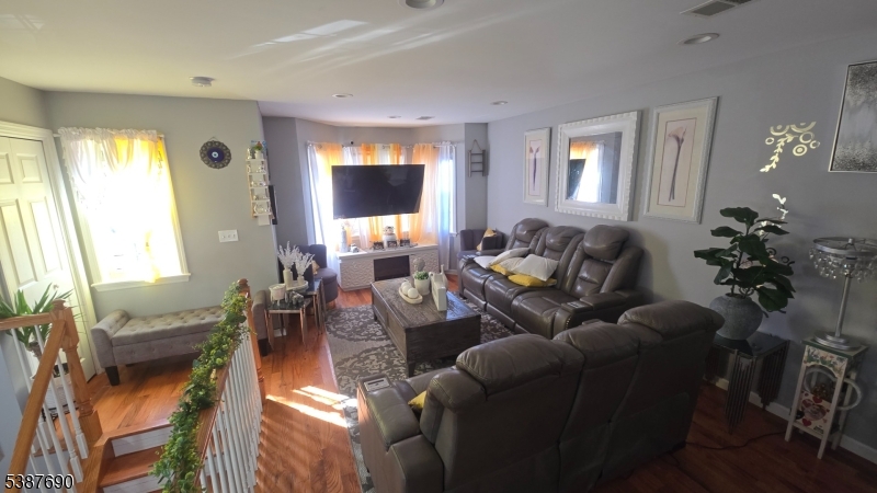 21 Rose Street Paterson, NJ 07501 - Photo 14 of 28 a living room with furniture and a large window