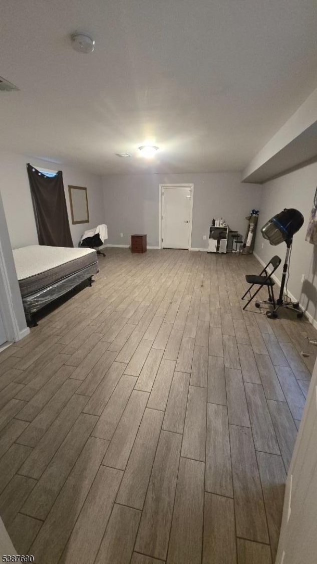 21 Rose Street Paterson, NJ 07501 - Photo 16 of 28 a view of a room with wooden floor and furniture