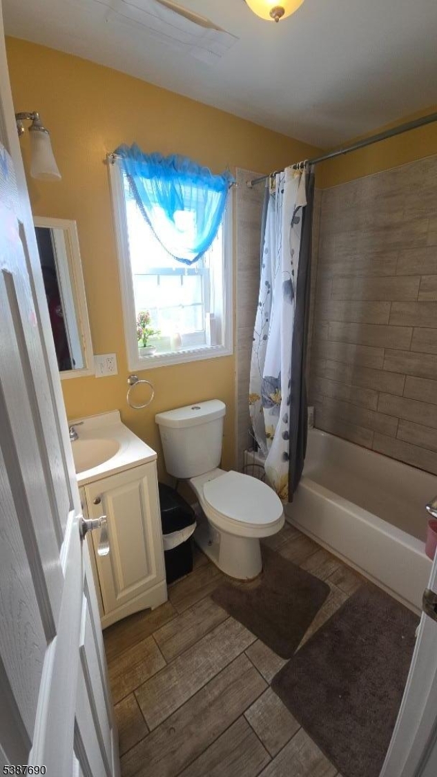 21 Rose Street Paterson, NJ 07501 - Photo 18 of 28 a bathroom with a toilet and a shower