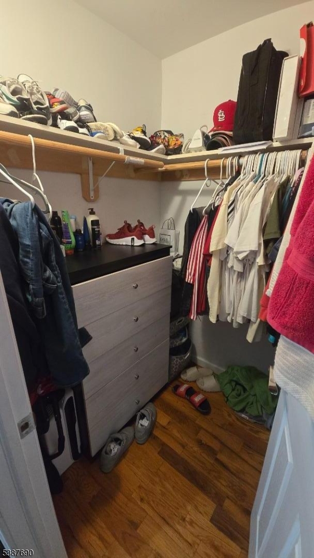 21 Rose Street Paterson, NJ 07501 - Photo 21 of 28 a view of walk in closet with clothes and shoes