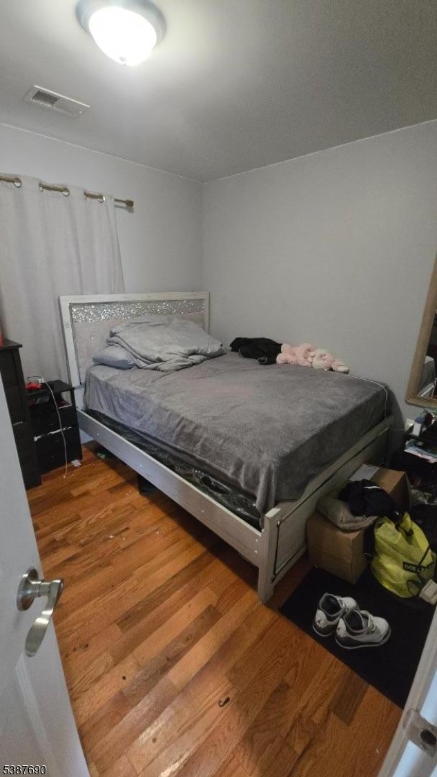 21 Rose Street Paterson, NJ 07501 - Photo 23 of 28 a bedroom with bed and storage