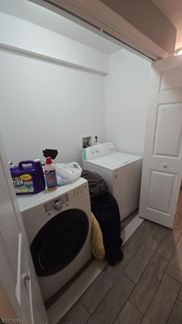 21 Rose Street Paterson, NJ 07501 - Photo 27 of 28 a utility room with dryer and washer