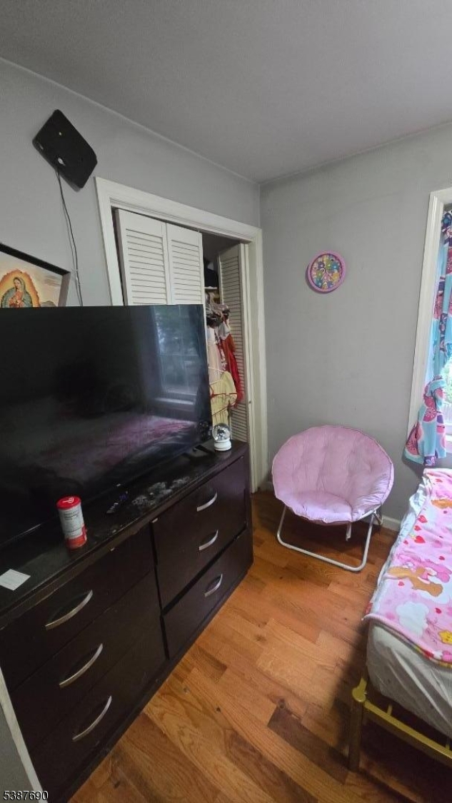 21 Rose Street Paterson, NJ 07501 - Photo 10 of 28 a room with furniture and flat screen tv
