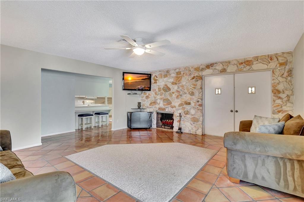 5405 Warren Street Naples, FL 34113 - Photo 10 of 37 With wood-burning fireplace and TV included