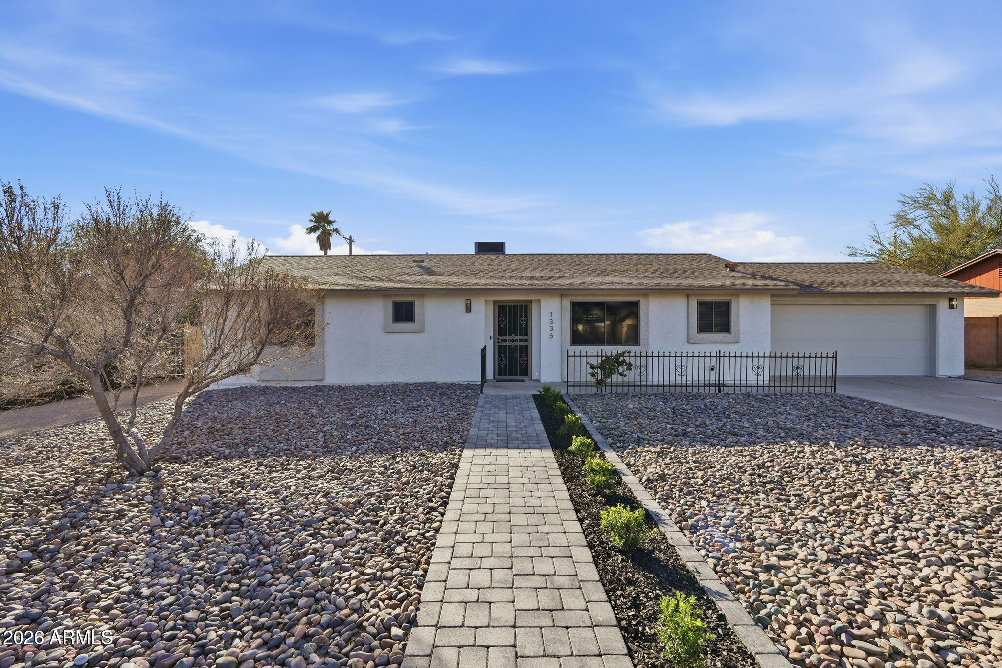 1336 South Cactus Road Apache Junction, AZ 85119 - Photo 1 of 37 a front view of a house with a yard