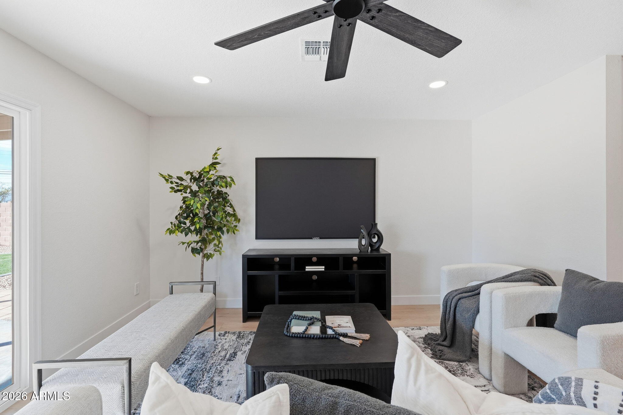 1336 South Cactus Road Apache Junction, AZ 85119 - Photo 16 of 37 a living room with furniture and a flat screen tv