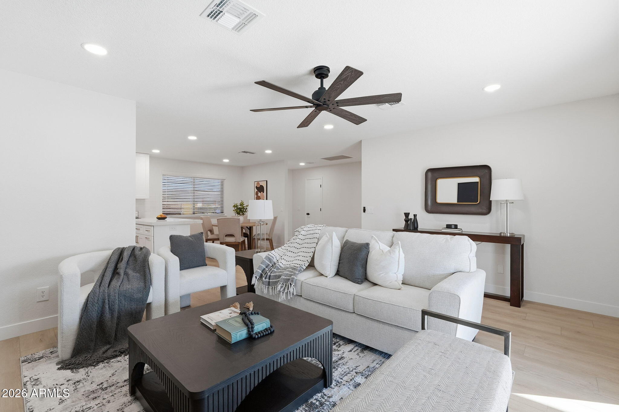 1336 South Cactus Road Apache Junction, AZ 85119 - Photo 17 of 37 a living room with furniture a rug and a ceiling fan