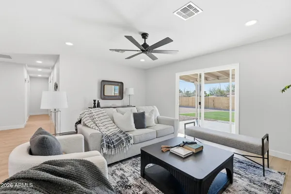 a living room with furniture and a window