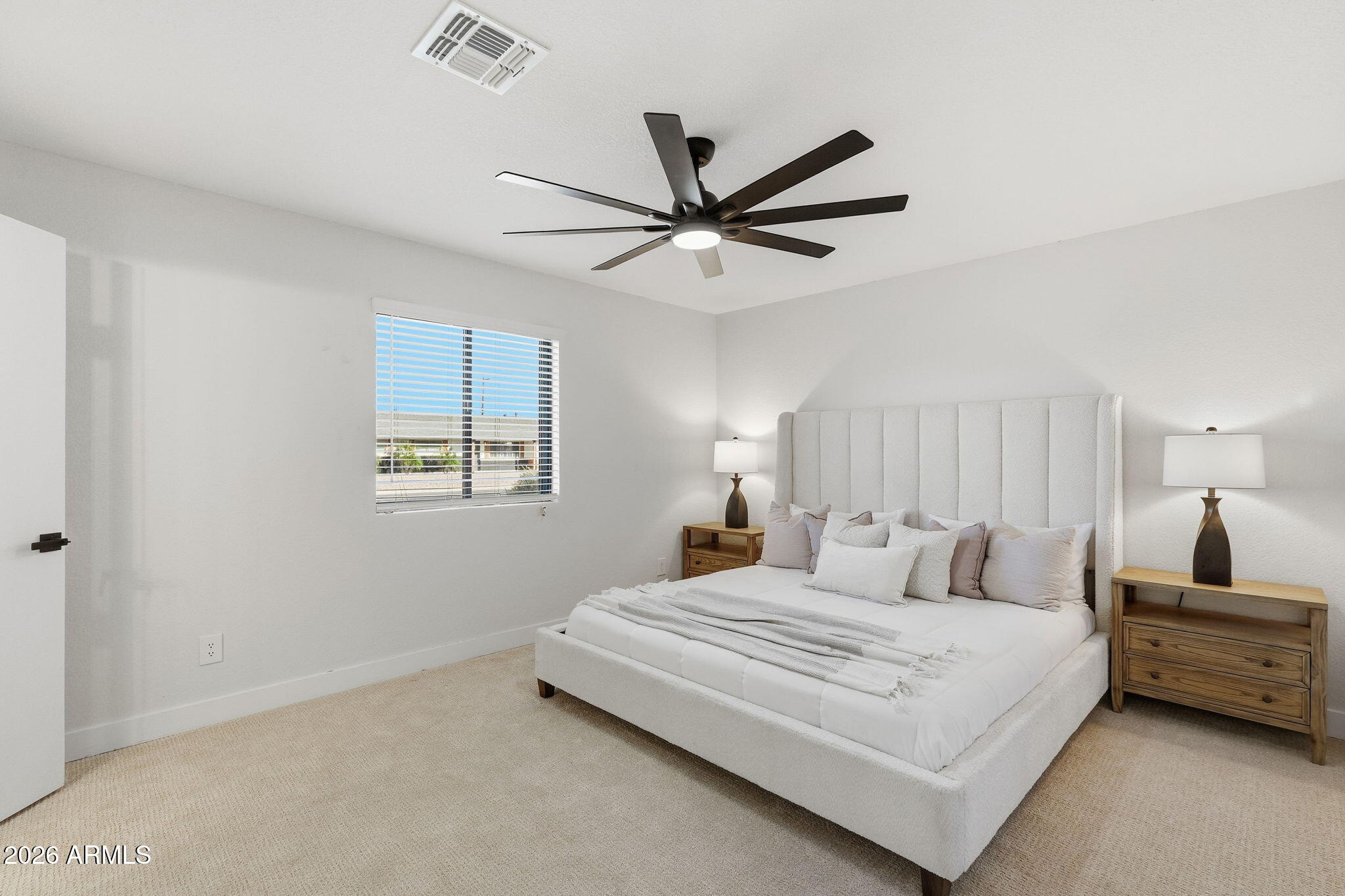 1336 South Cactus Road Apache Junction, AZ 85119 - Photo 25 of 37 a bedroom with a bed and a ceiling fan