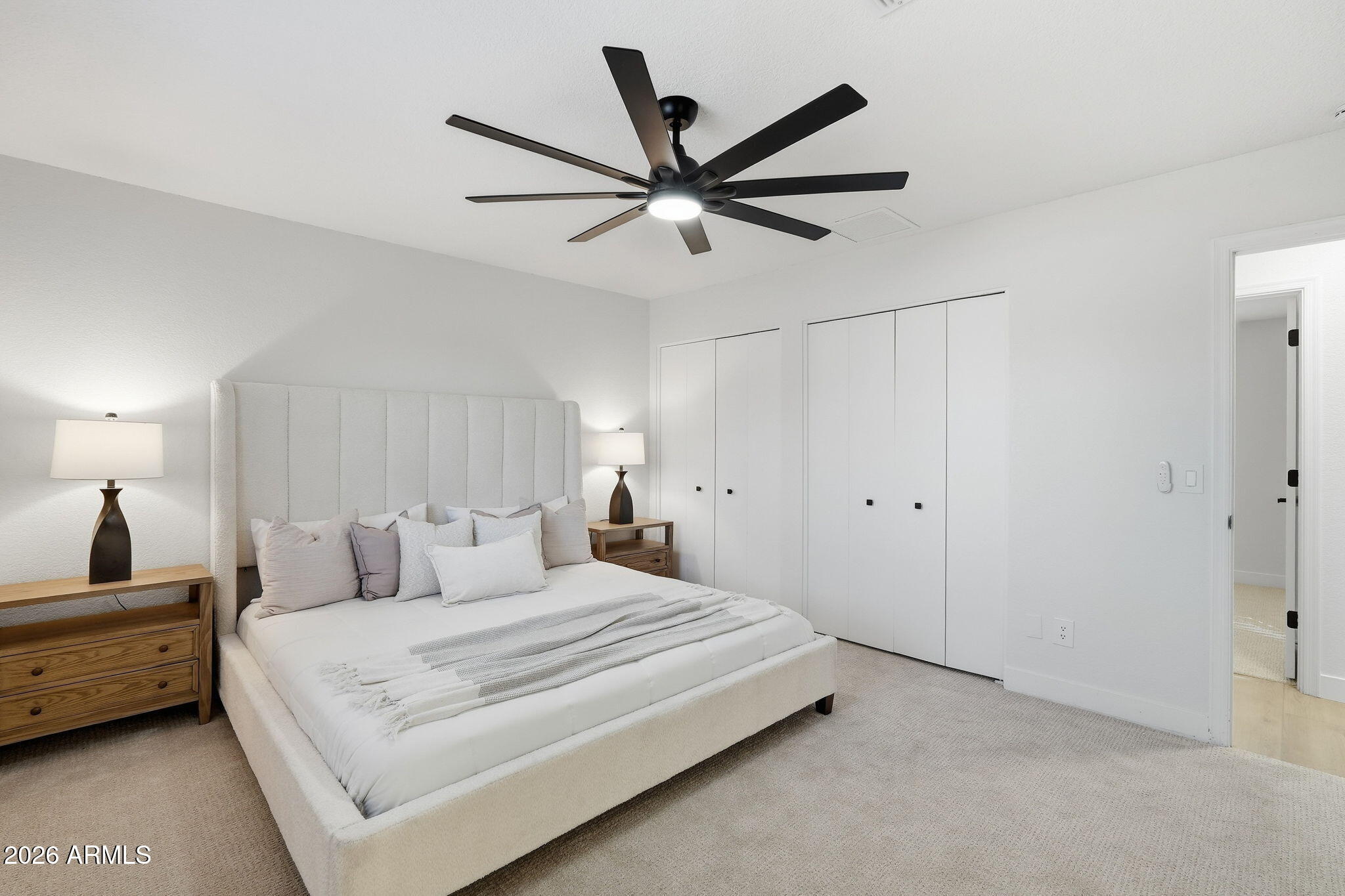 1336 South Cactus Road Apache Junction, AZ 85119 - Photo 26 of 37 a bedroom with a bed and a ceiling fan