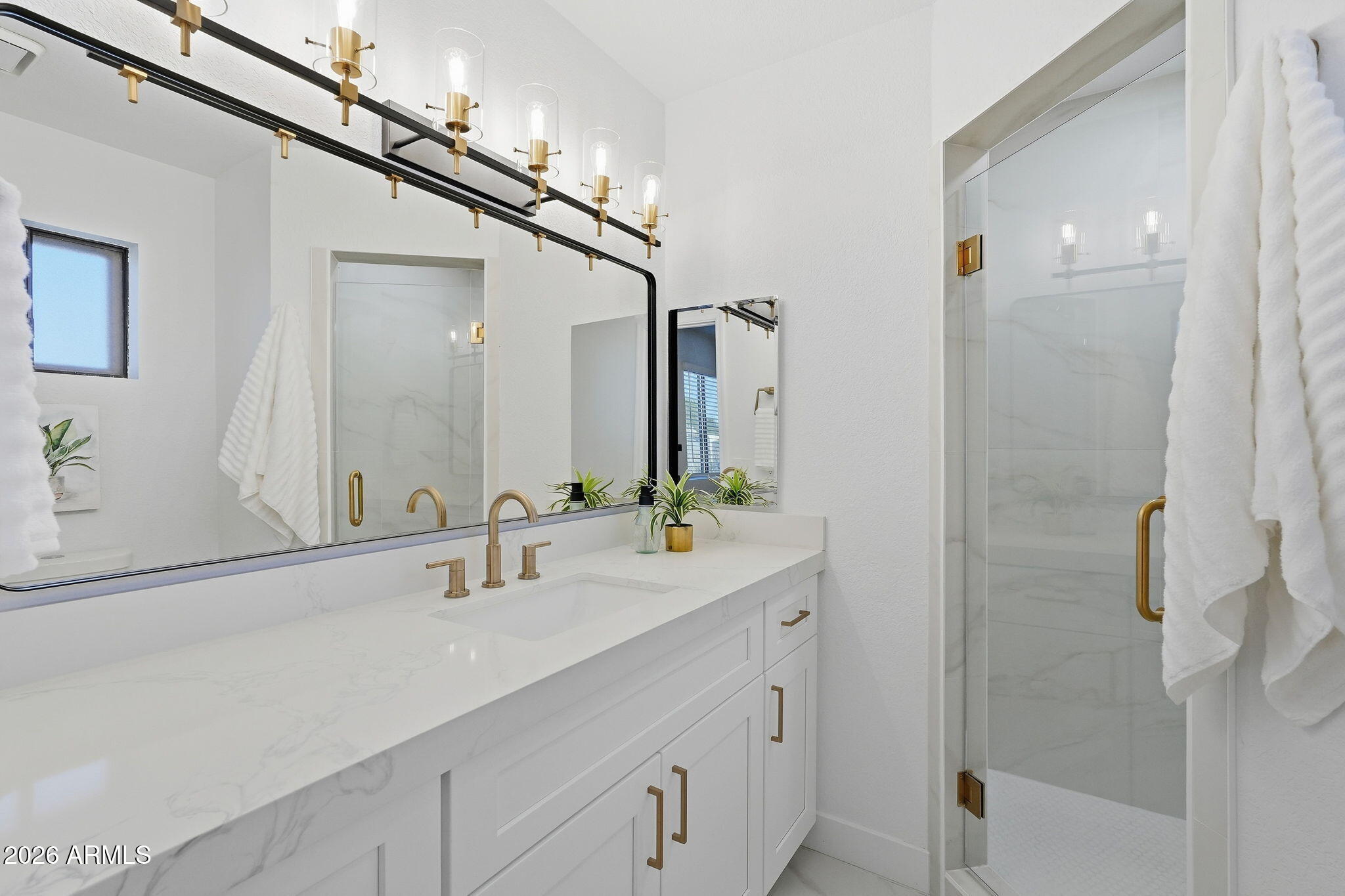 1336 South Cactus Road Apache Junction, AZ 85119 - Photo 29 of 37 a bathroom with a double vanity sink a mirror and shower