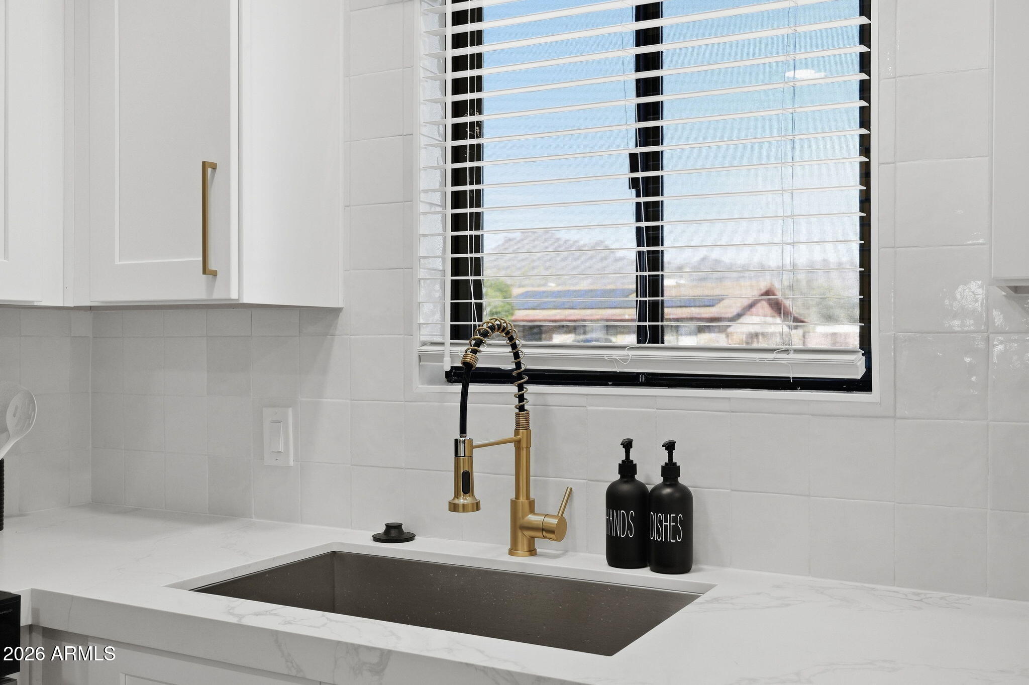 1336 South Cactus Road Apache Junction, AZ 85119 - Photo 10 of 37 a bathroom with a sink and mirror