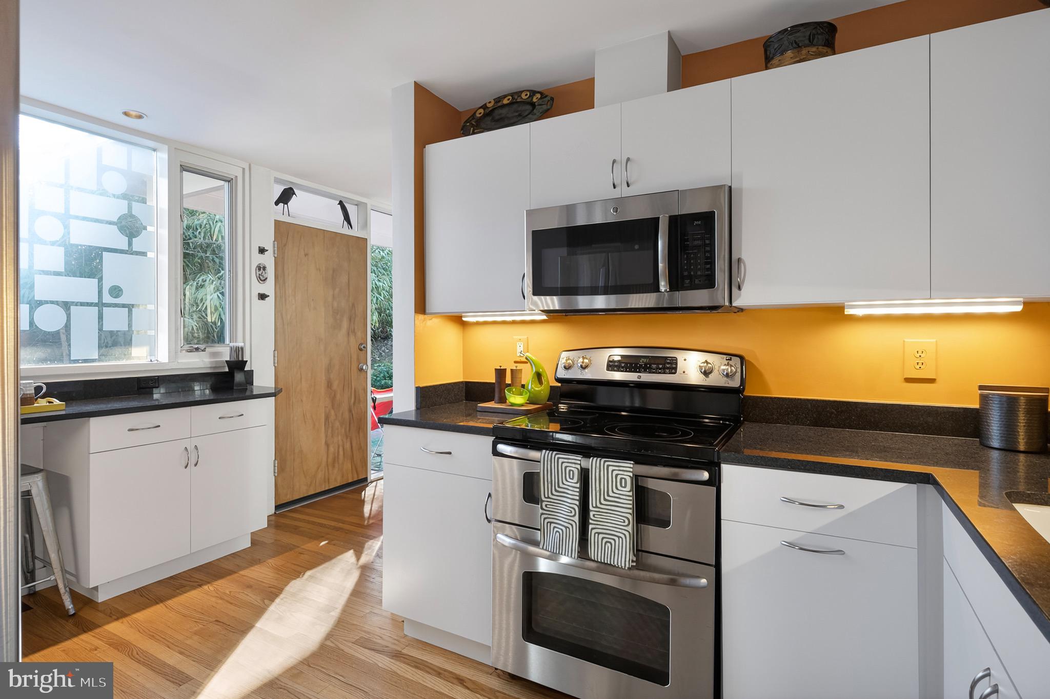 2205 Paul Spring Road Alexandria, VA 22307 - Photo 23 of 131 a kitchen with stainless steel appliances a stove a microwave and a refrigerator