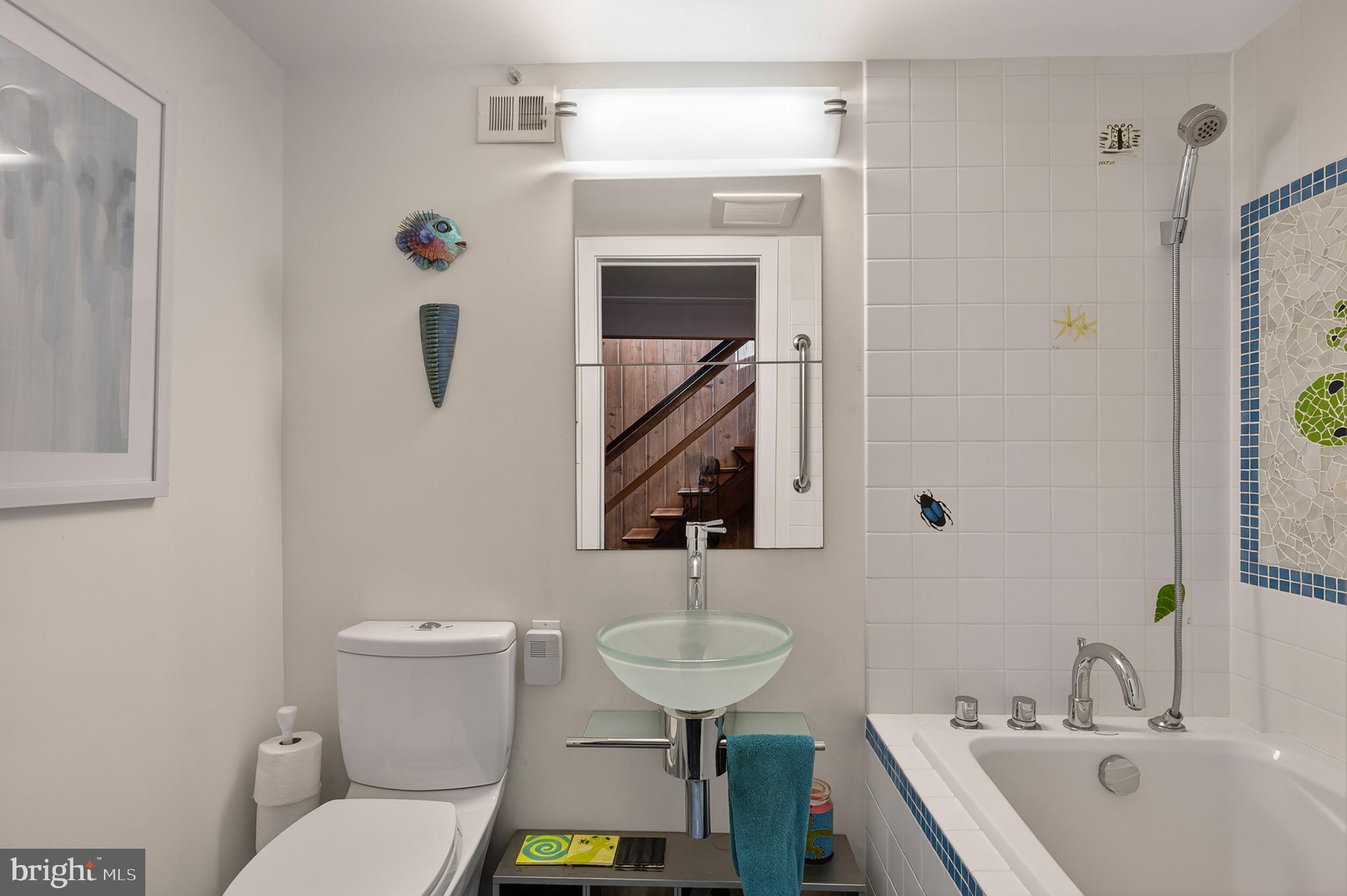 2205 Paul Spring Road Alexandria, VA 22307 - Photo 65 of 131 a bathroom with a sink a toilet and a mirror