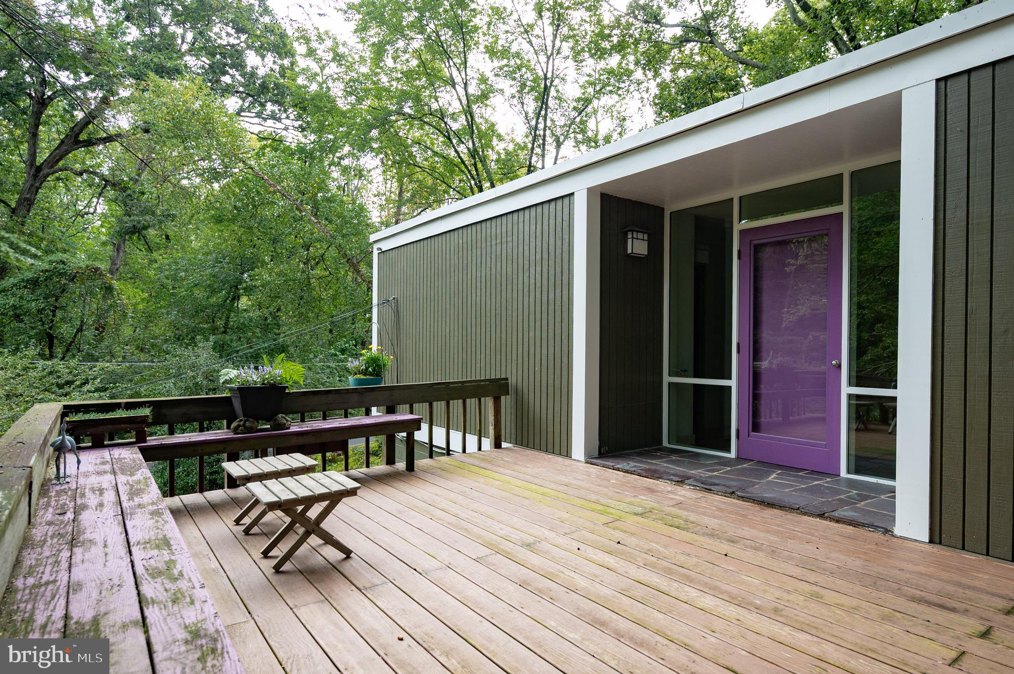 2205 Paul Spring Road Alexandria, VA 22307 - Photo 67 of 131 a backyard of a house with wooden floor outdoor seating and yard in the back