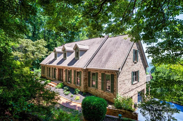 a aerial view of a house with a yard