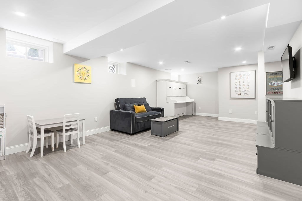 7 Maple Place Needham, MA 02492 - Photo 17 of 26 a living room with furniture and a wooden floor