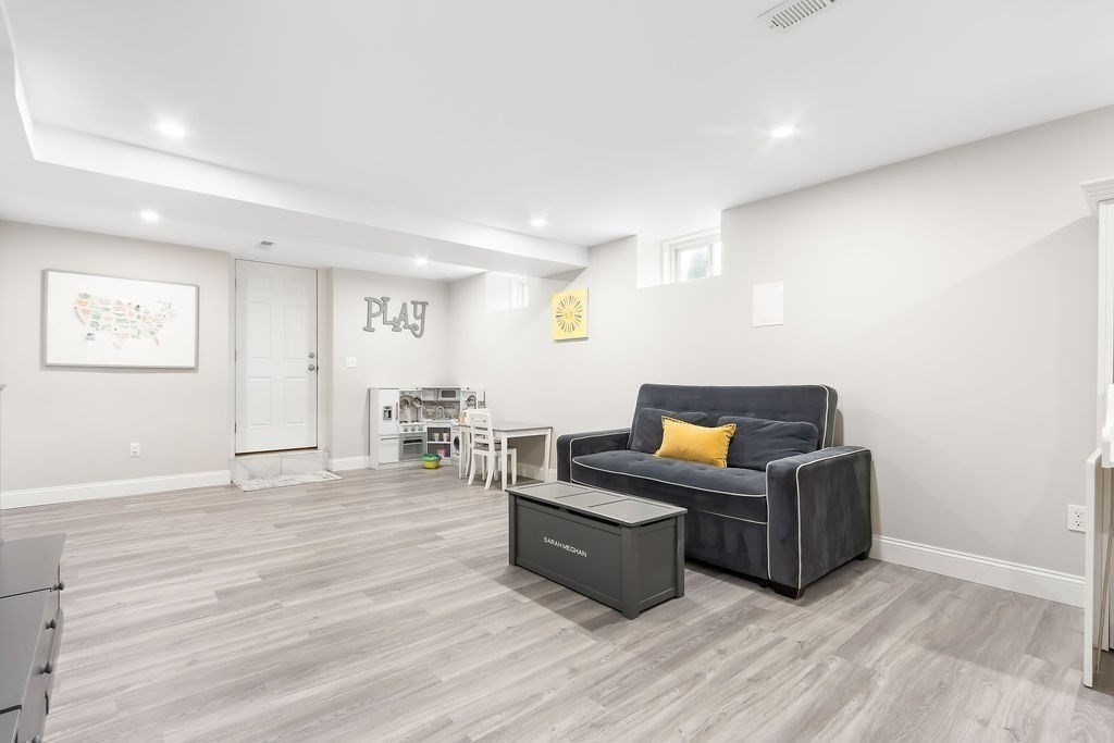 7 Maple Place Needham, MA 02492 - Photo 18 of 26 a living room with furniture and wooden floor
