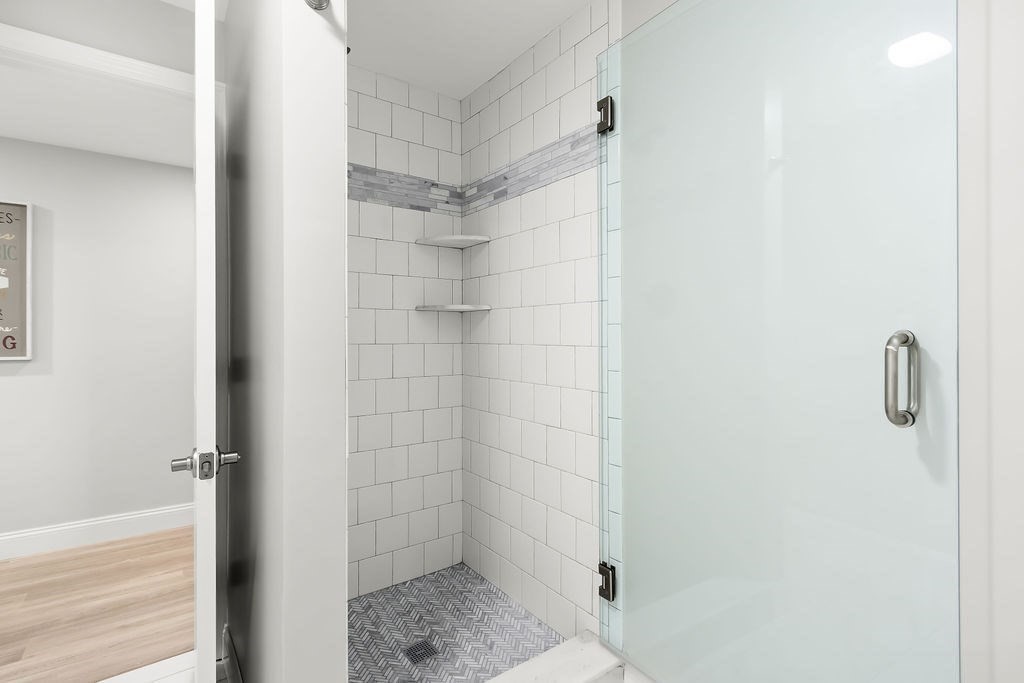 7 Maple Place Needham, MA 02492 - Photo 20 of 26 a bathroom with a shower