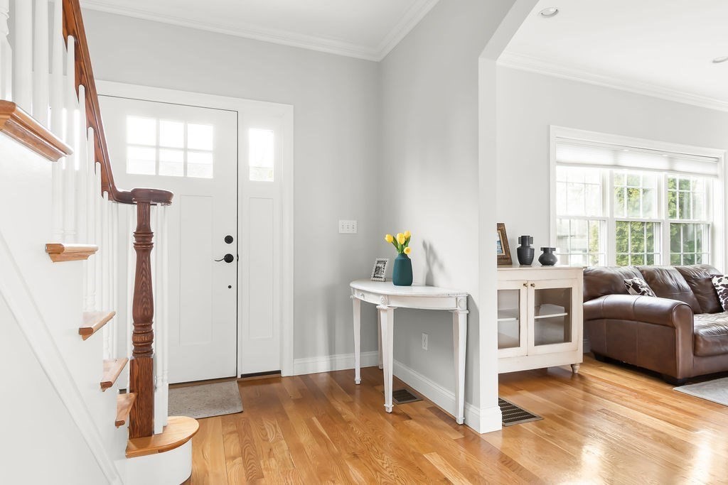 7 Maple Place Needham, MA 02492 - Photo 2 of 26 a living room with furniture and a window