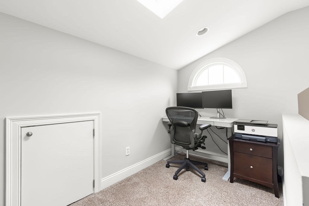 7 Maple Place Needham, MA 02492 - Photo 22 of 26 a view of a workspace with furniture and a window
