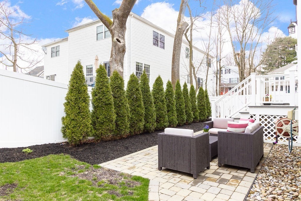 7 Maple Place Needham, MA 02492 - Photo 25 of 26 a view of a patio with iron fence