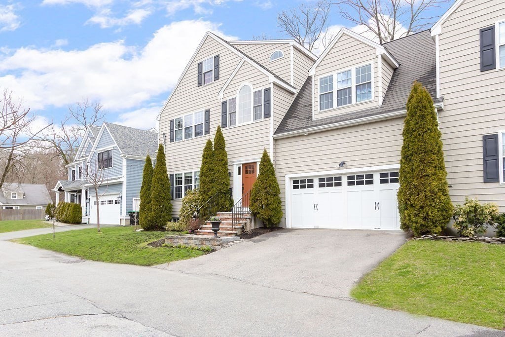 7 Maple Place Needham, MA 02492 - Photo 26 of 26 a view of a white house with a yard