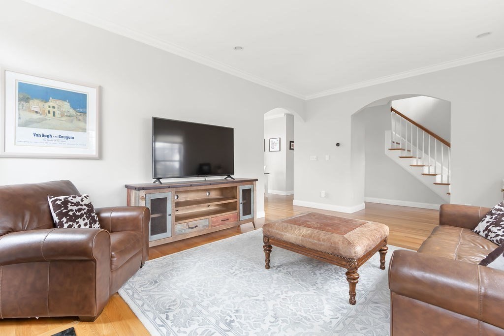 7 Maple Place Needham, MA 02492 - Photo 4 of 26 a living room with furniture and a flat screen tv