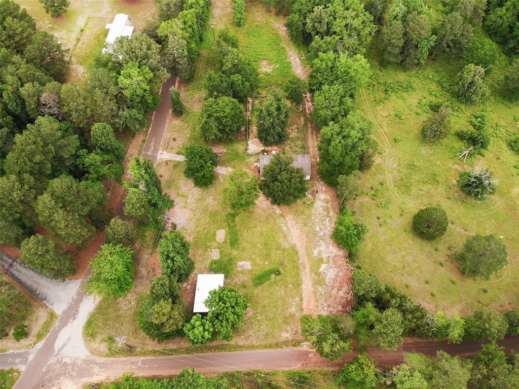 an aerial view of residential houses with yard