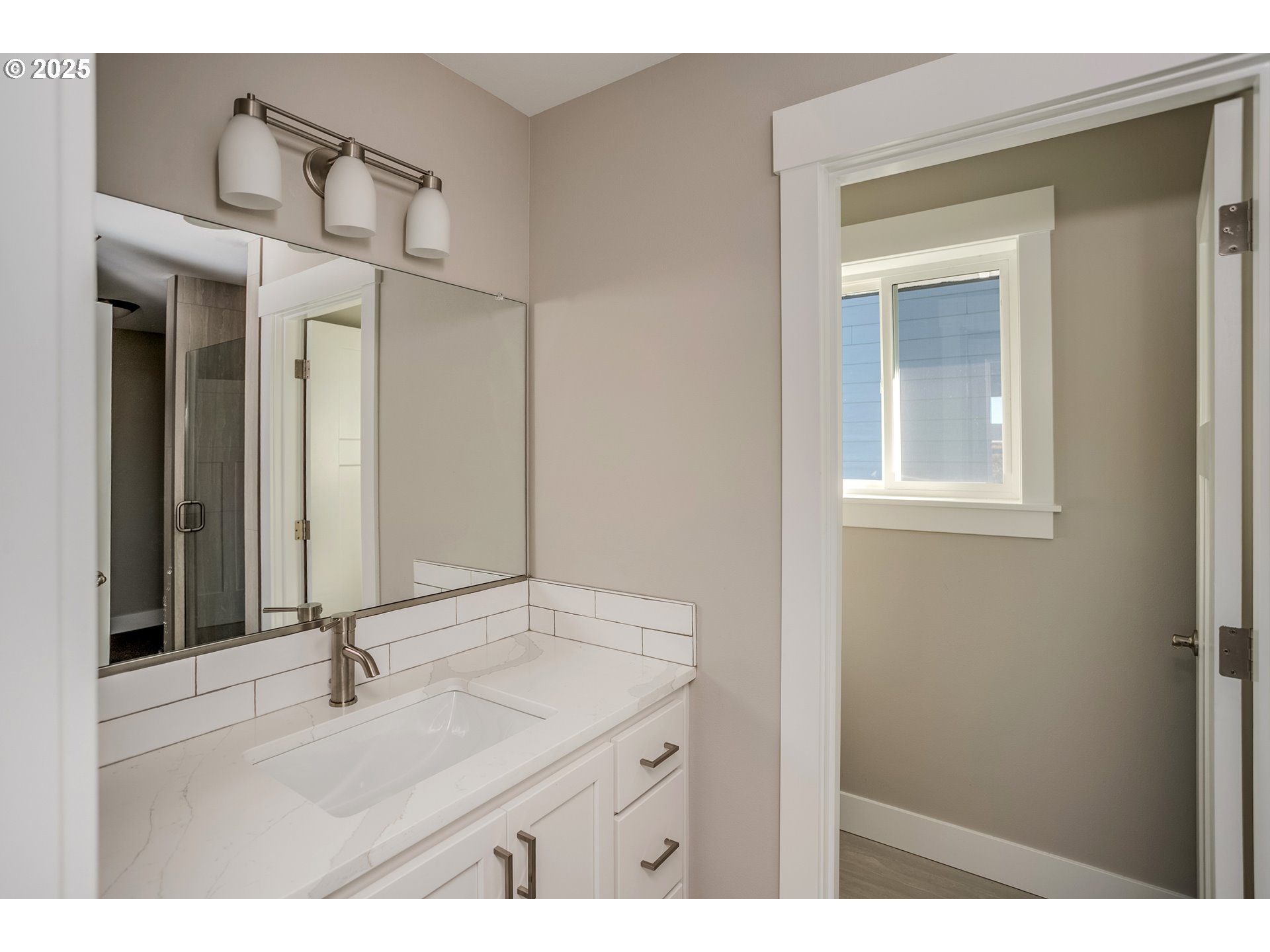 790 17th Avenue Seaside, OR 97138 - Photo 17 of 29 a bathroom with a sink and a mirror