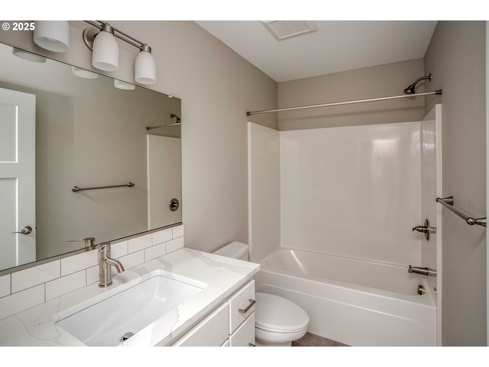 790 17th Avenue Seaside, OR 97138 - Photo 18 of 29 a bathroom with a bathtub shower sink vanity and a toilet