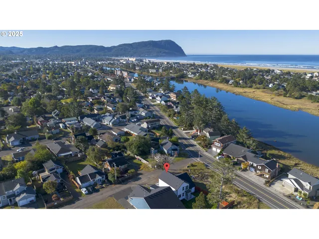 a aerial view of a house with a yard