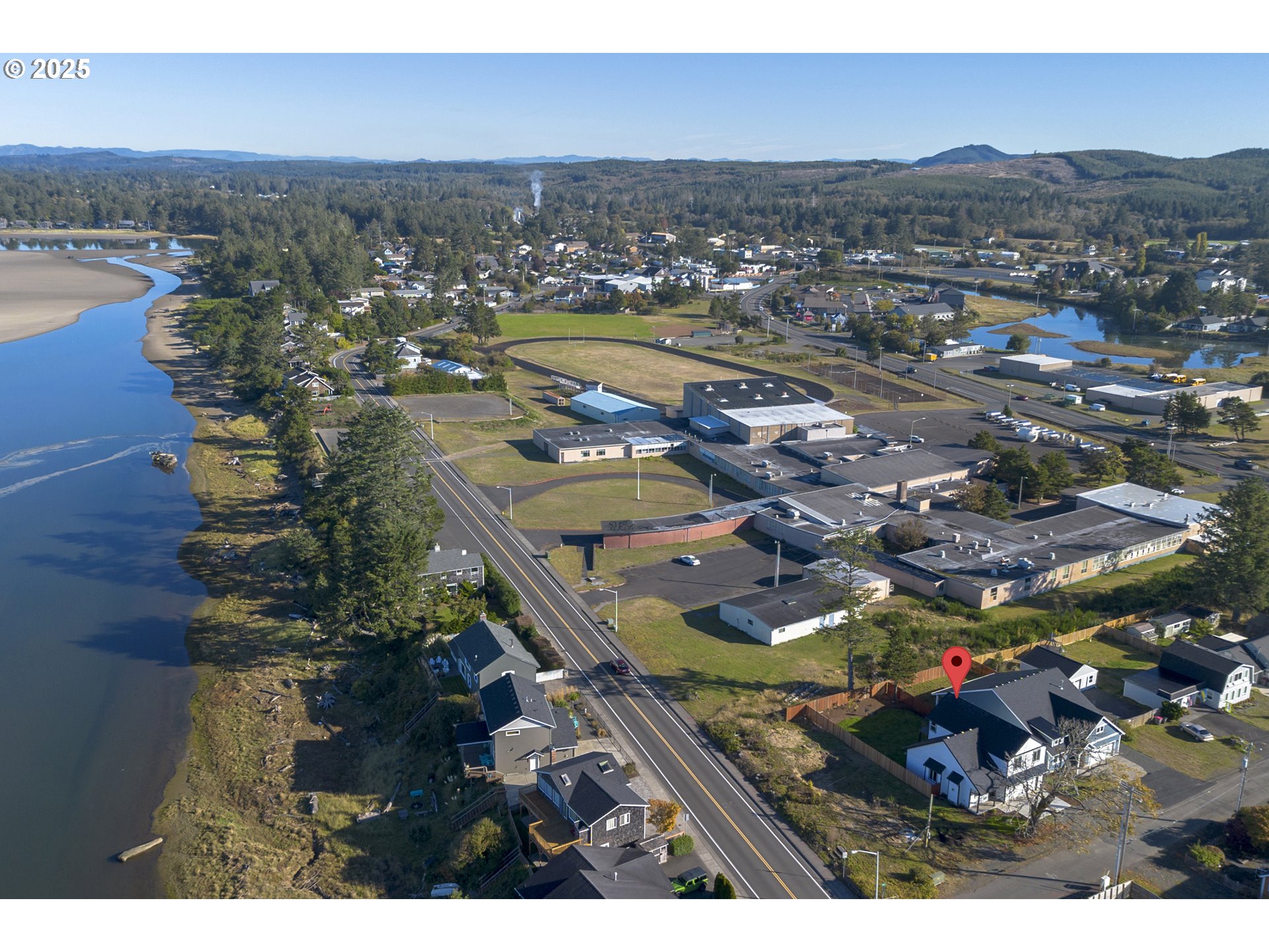 790 17th Avenue Seaside, OR 97138 - Photo 27 of 29 an aerial view of residential houses with outdoor space