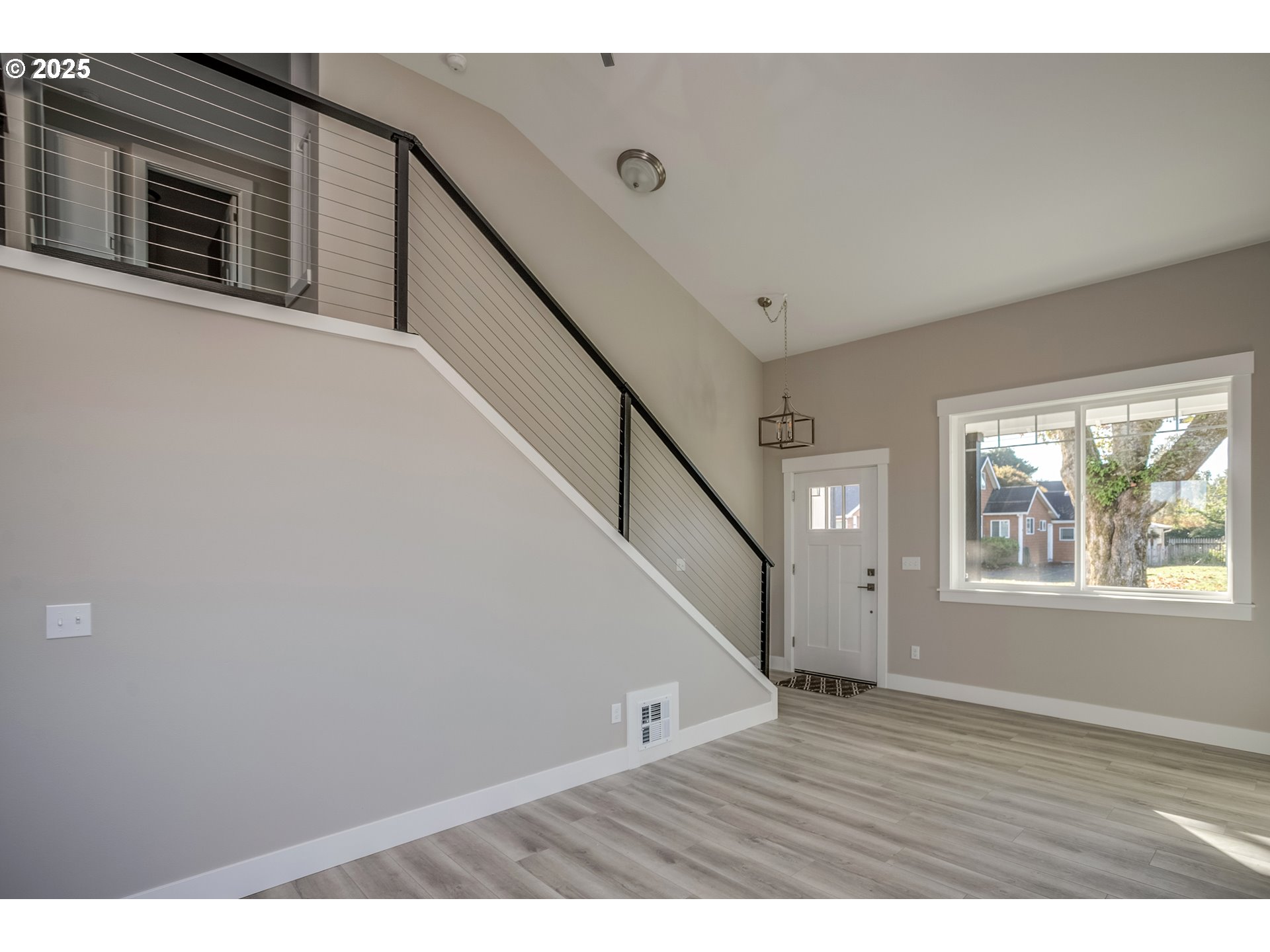 790 17th Avenue Seaside, OR 97138 - Photo 5 of 29 a view of an entryway with wooden floor
