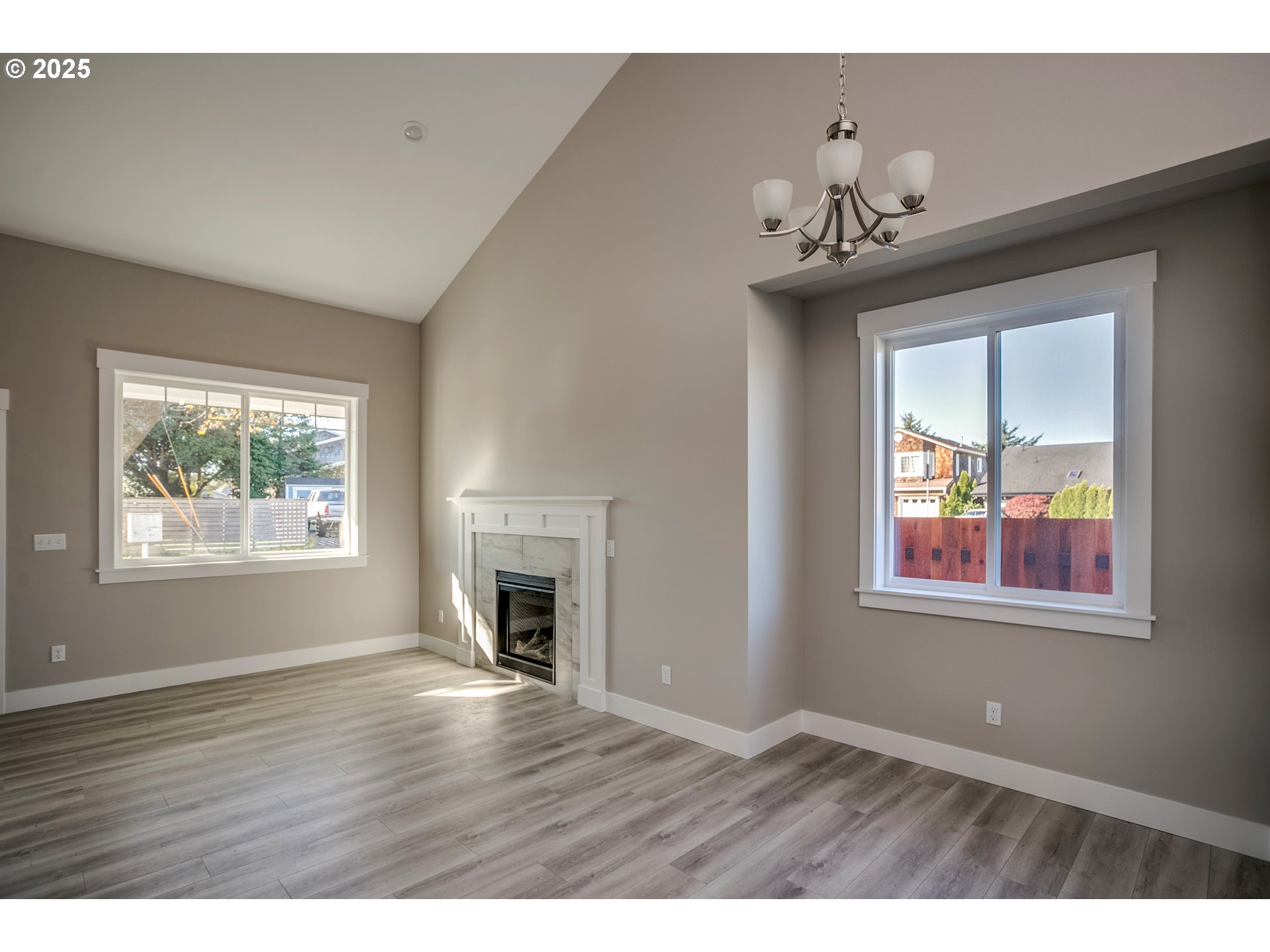790 17th Avenue Seaside, OR 97138 - Photo 6 of 29 a view of an empty room with a window and wooden floor