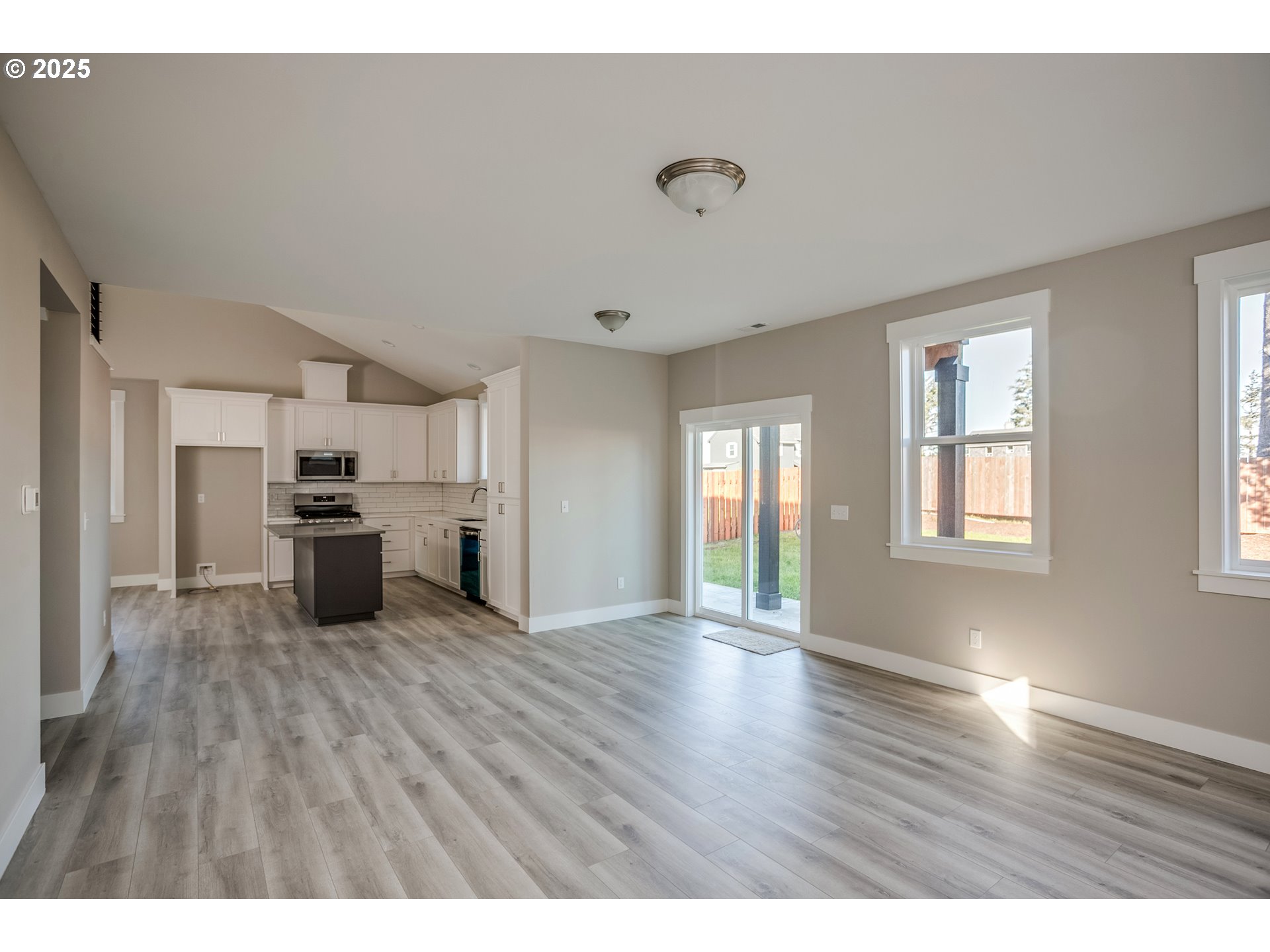 790 17th Avenue Seaside, OR 97138 - Photo 10 of 29 a open kitchen with cabinets wooden floor and stainless steel appliances