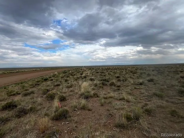 a view of a terrace with wooden floor and fence