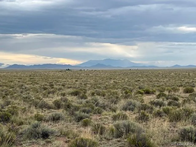 a view of an ocean with a mountain