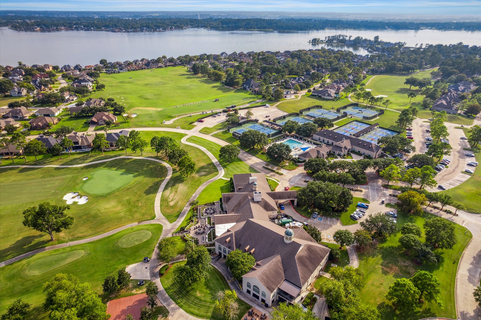 203 Hampton Glen Road Montgomery, TX 77356 - Photo 34 of 35 Bentwater offers resort-style living on the shores of Lake Conroe with an exceptional array of amenities, including three 18-hole championship golf courses, a full-service marina with boat access to the lake, tennis and pickleball facilities, a fitness center, sparkling community pools, and a luxury country club. Residents enjoy dining, social events, scenic walking trails, parks, and a vibrant, gated community lifestyle conveniently located near shopping, dining, and medical facilities.