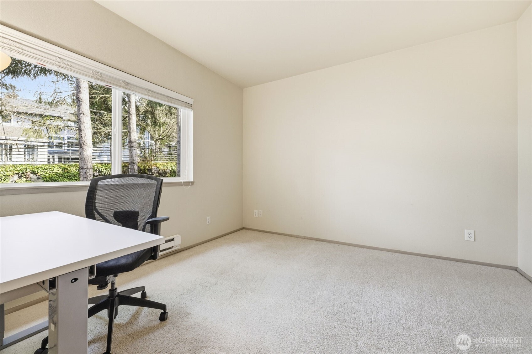3914 243rd Place Southeast, Unit L301 Bothell, WA 98021 - Photo 12 of 19 a view of a workspace with furniture and a window