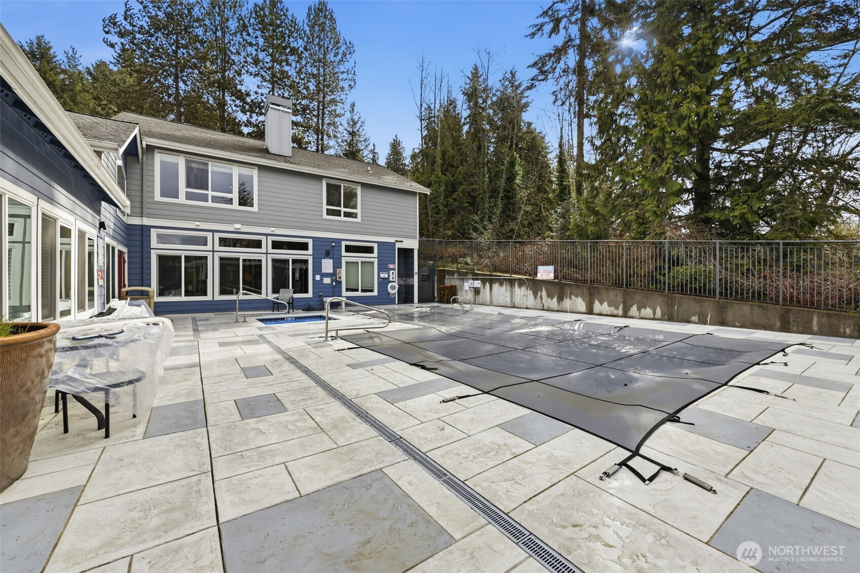 3914 243rd Place Southeast, Unit L301 Bothell, WA 98021 - Photo 17 of 19 a view of a patio with couches and table and chairs with wooden floor and fence