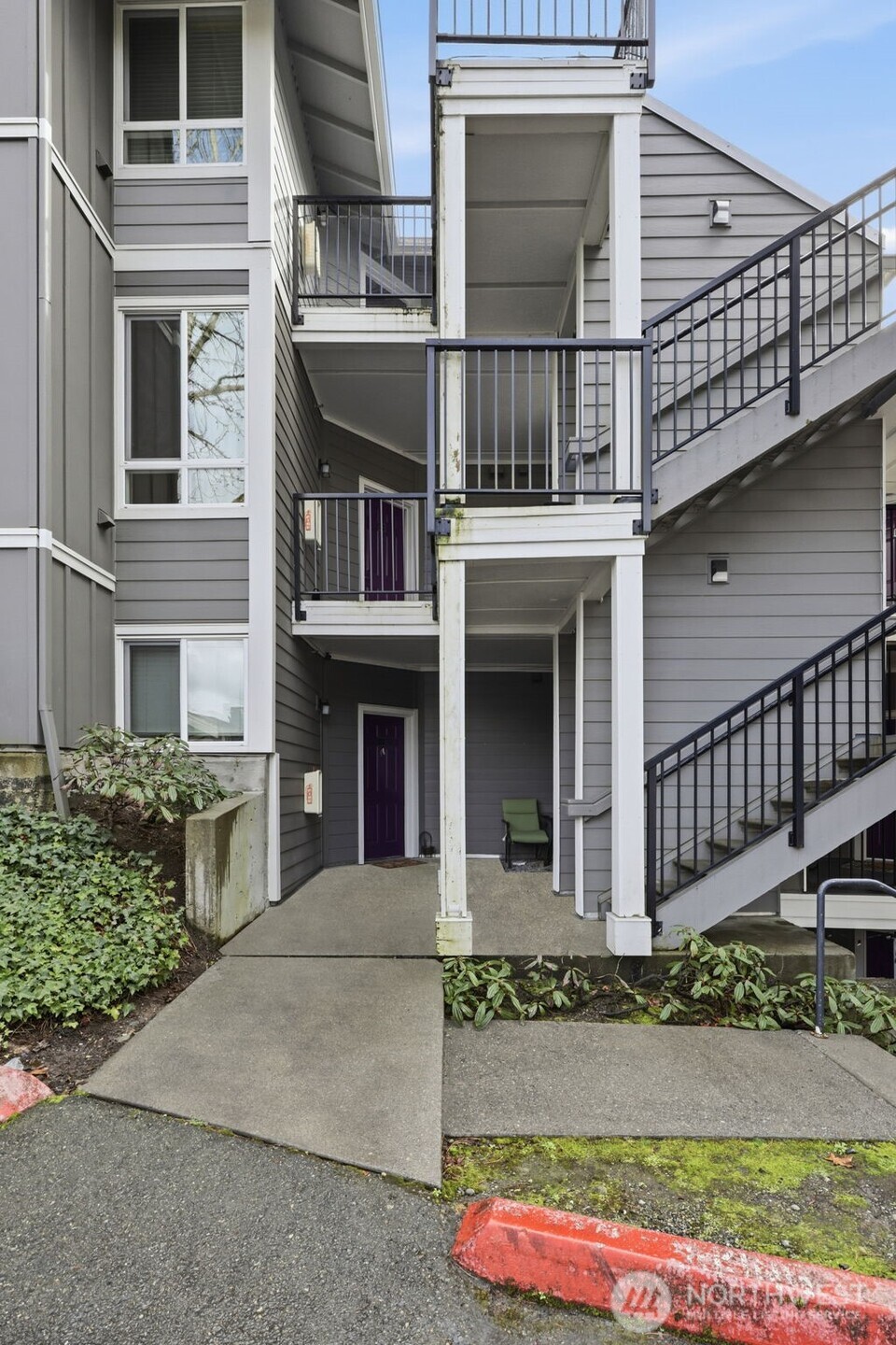 3914 243rd Place Southeast, Unit L301 Bothell, WA 98021 - Photo 2 of 19 front view of a house with a yard