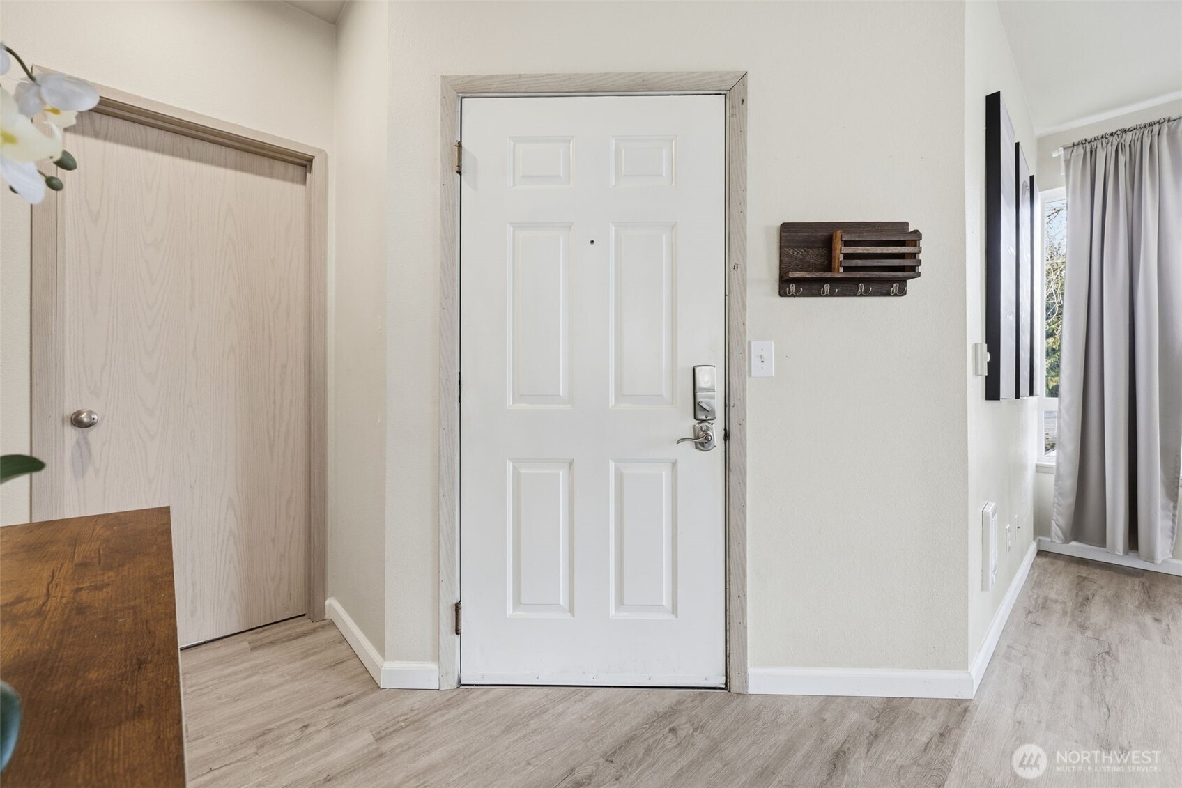 3914 243rd Place Southeast, Unit L301 Bothell, WA 98021 - Photo 9 of 19 a view of a livingroom with wooden floor