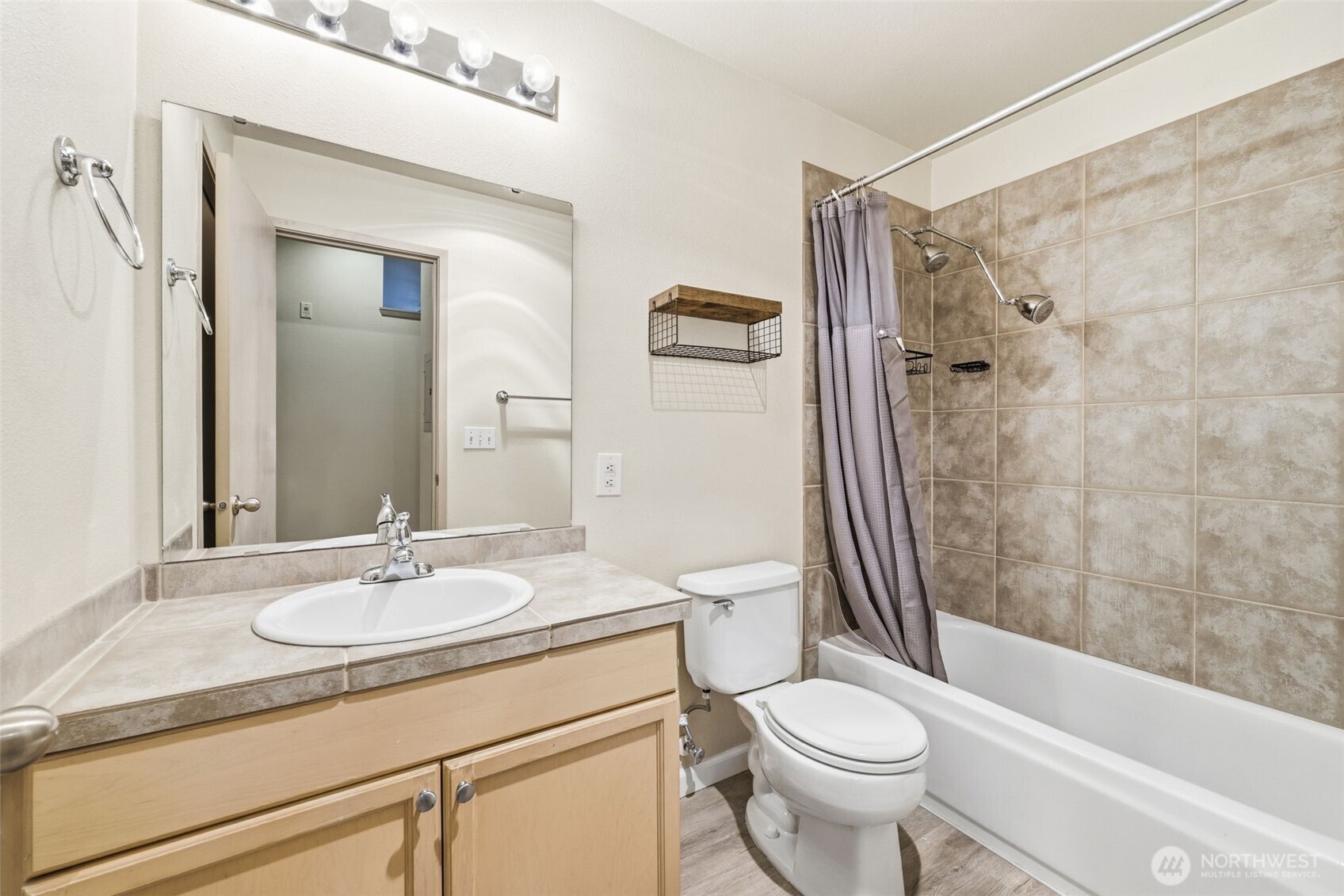 3914 243rd Place Southeast, Unit L301 Bothell, WA 98021 - Photo 10 of 19 a bathroom with a sink toilet and shower