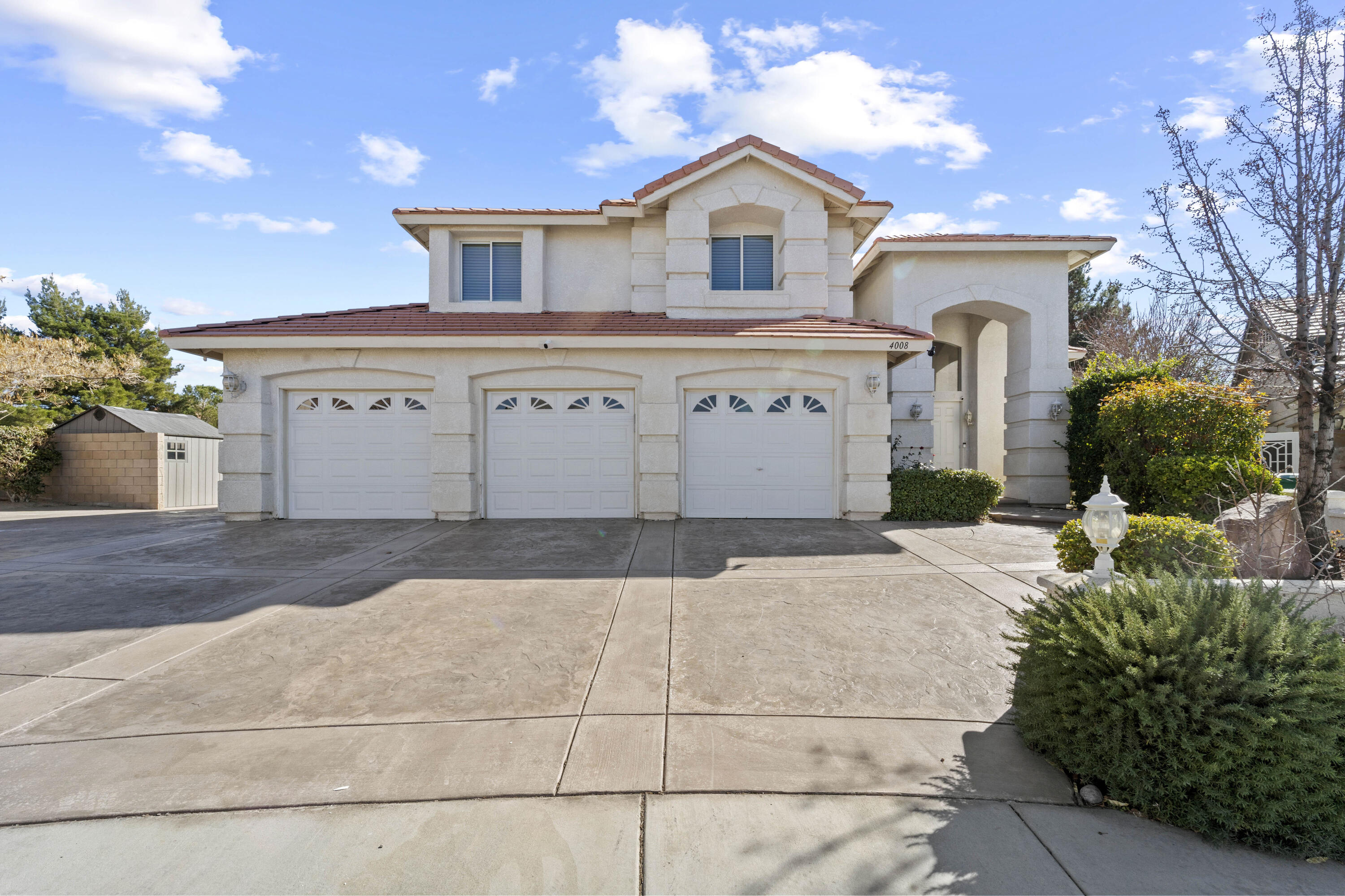 4008 Dee Dee Court Lancaster, CA 93536 - Photo 1 of 8 a front view of a house with garden