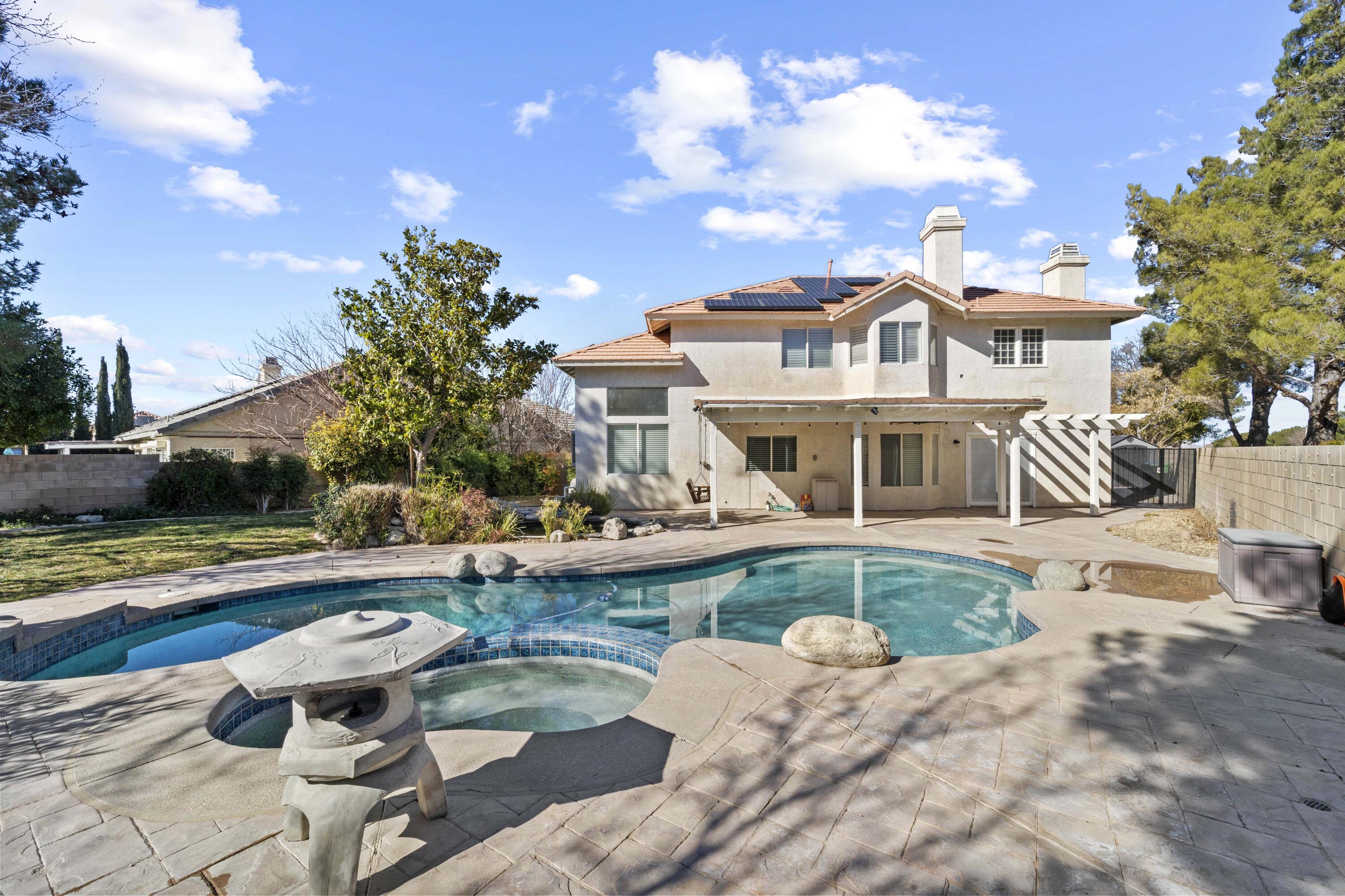 4008 Dee Dee Court Lancaster, CA 93536 - Photo 2 of 8 a front view of a house with swimming pool and porch