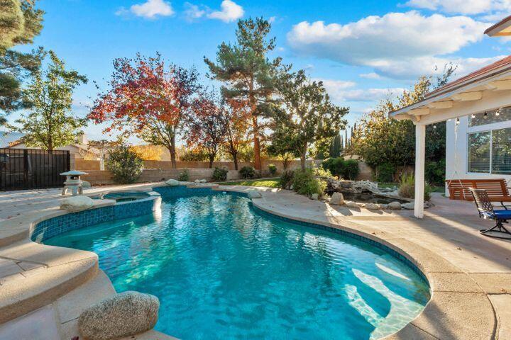 4008 Dee Dee Court Lancaster, CA 93536 - Photo 3 of 8 a view of a swimming pool with a patio and a yard
